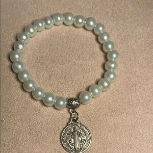 Elegant St. Benedict White Pearl Bracelet with Silver Charm